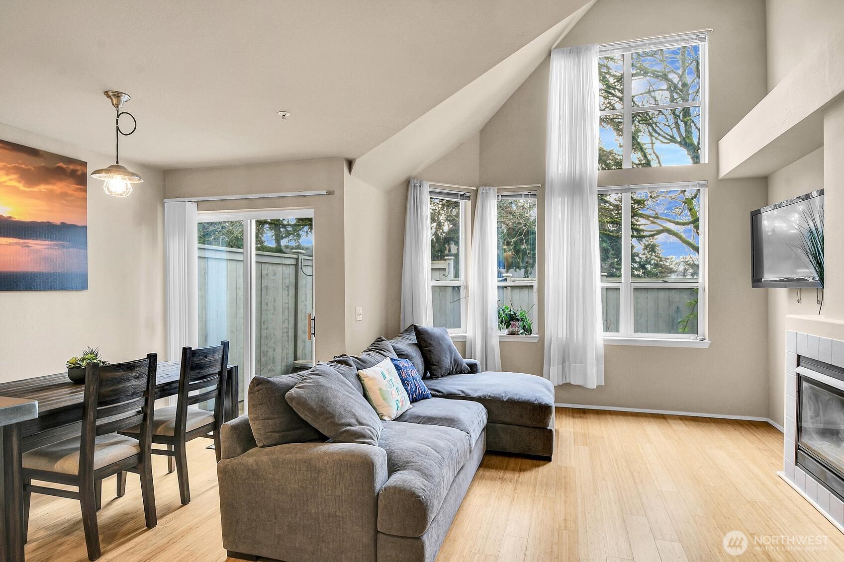 Great natural light in the living/dining room area with wall of windows. Gas fireplace.