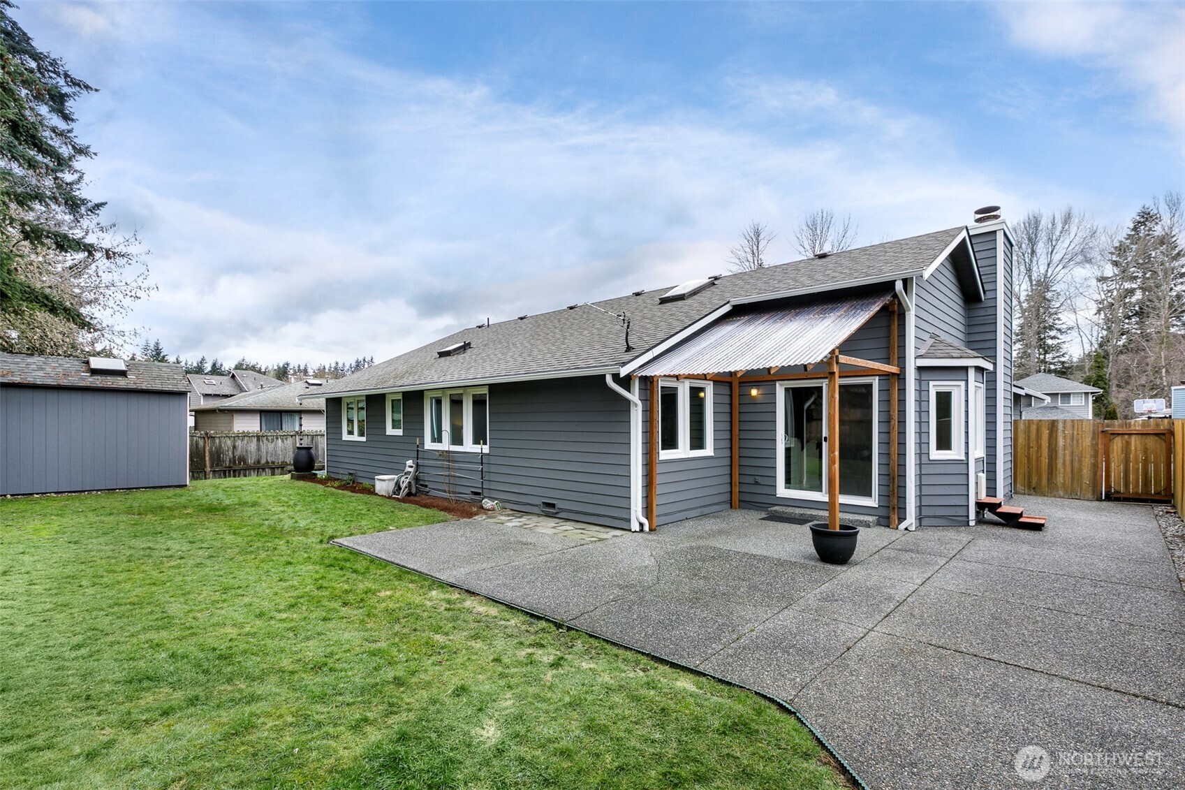 Large patio area w/ covered grill area & good lawn/play space