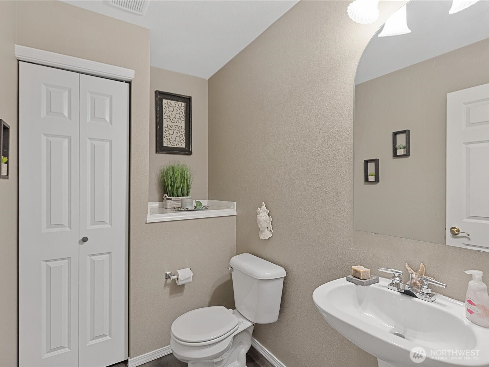 lower main guest bathroom with linen/storage closet.