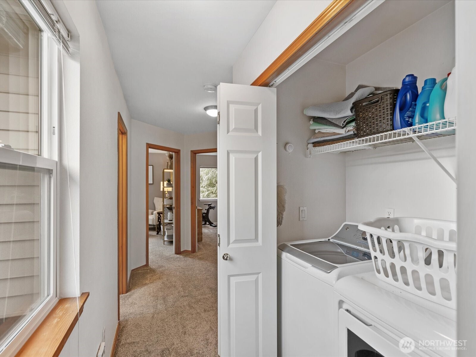 laundry closet in hall upstairs. Washer & Dryer stay with home.