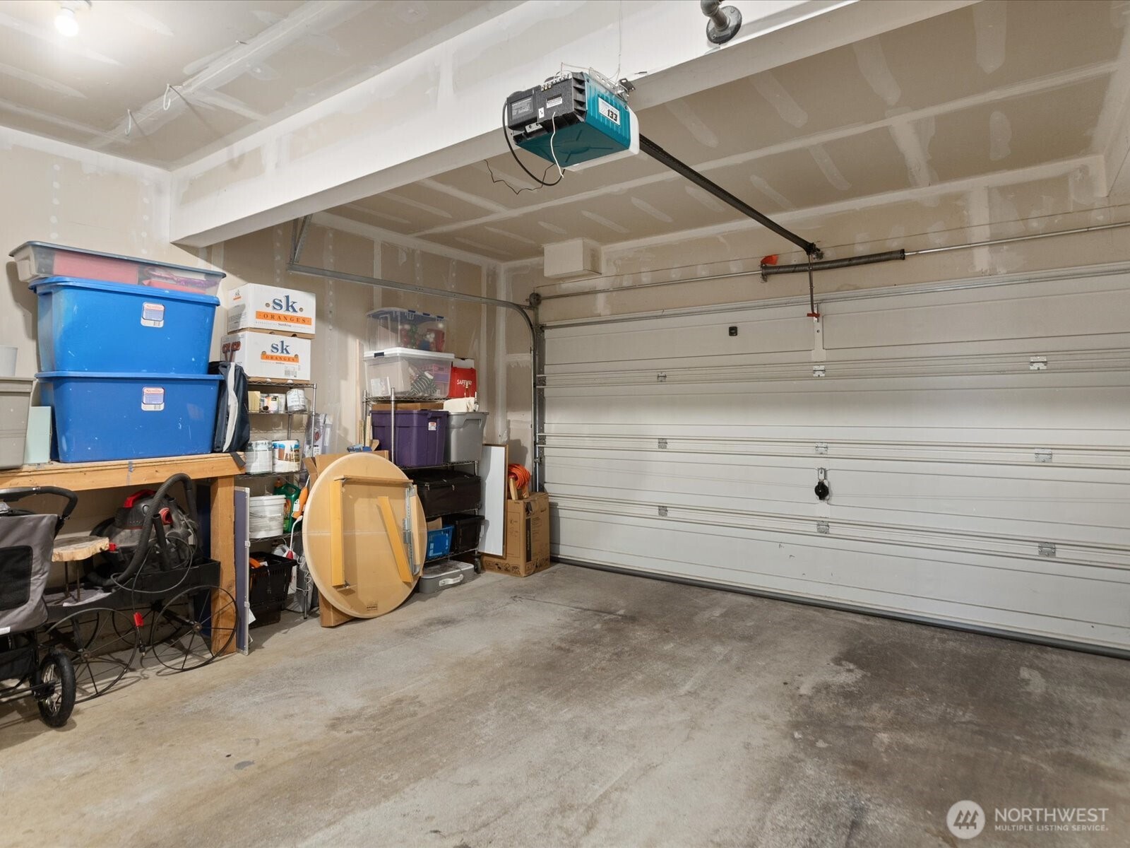 Two car garage. Furnace & water heater located at front of garage. Big enough for storage on sides & two cars.