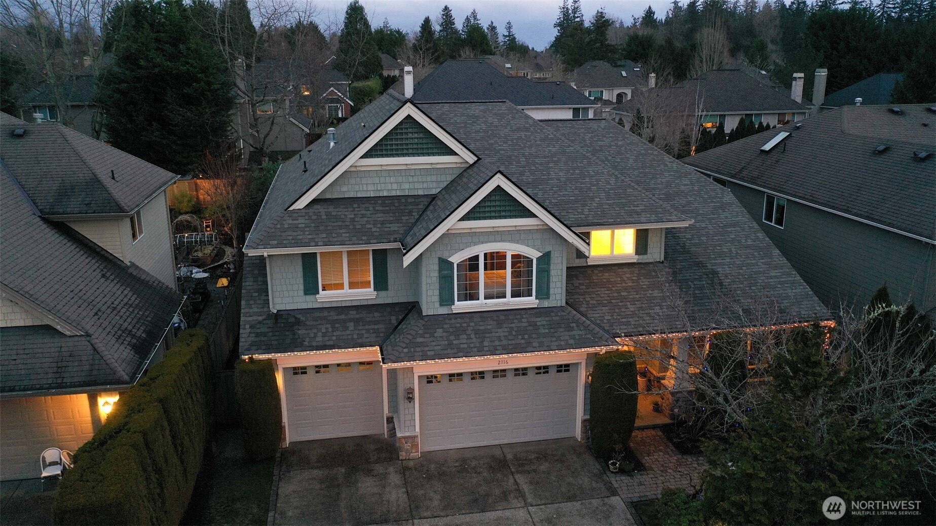 A Grand Entry with 2-Story tall entry, nice design features, curved Staircase, Iron Balusters, curved walls, stylish pillars and a full engineered floor.