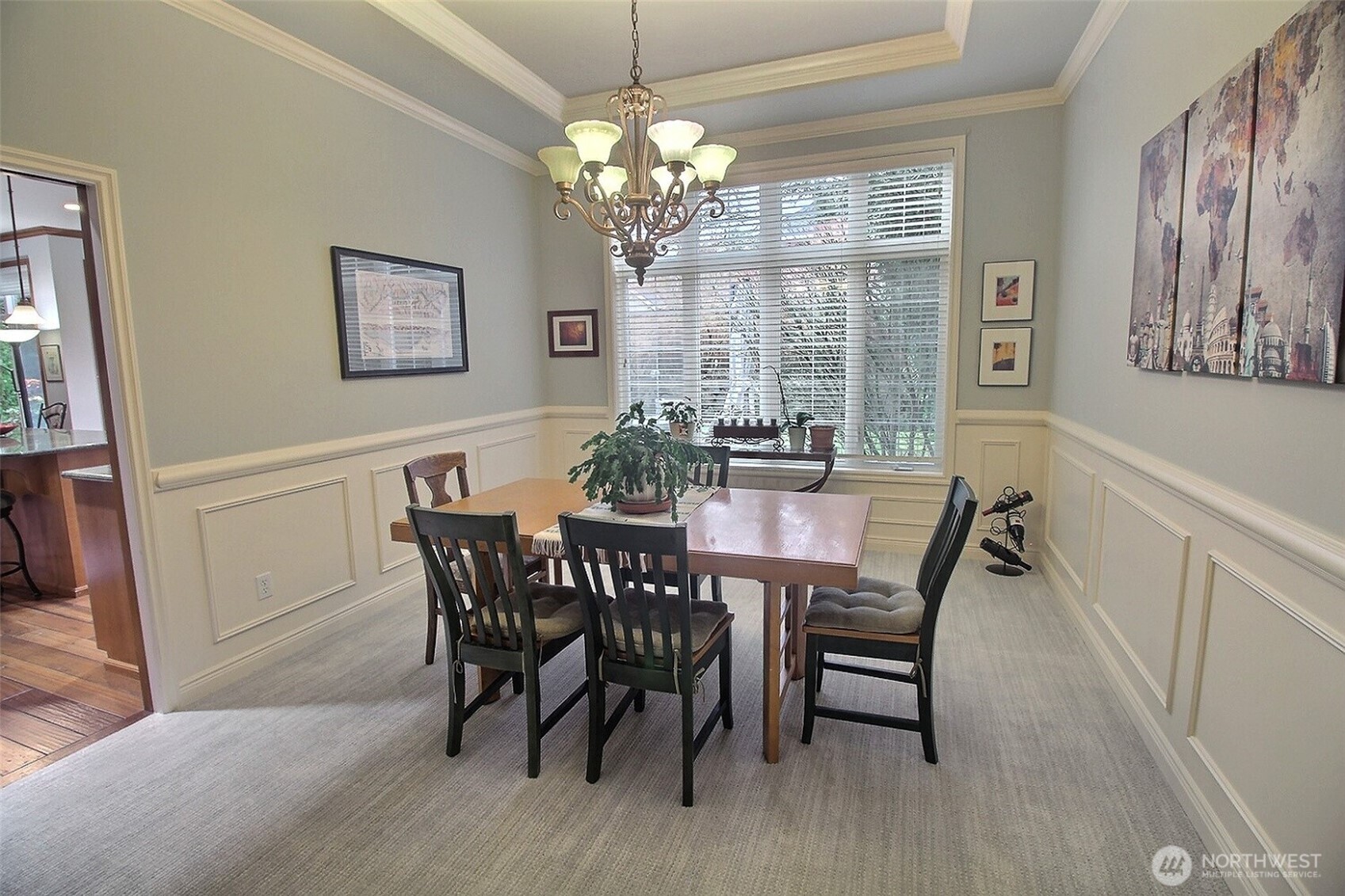 French doors open into this well-appointed Office with dark wainscotting and trim throughout.