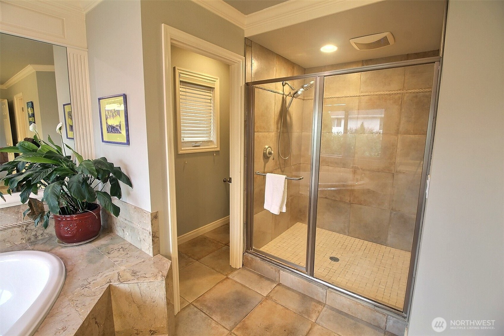 Primary Bath Soaking tub with a view of the trees and birds!