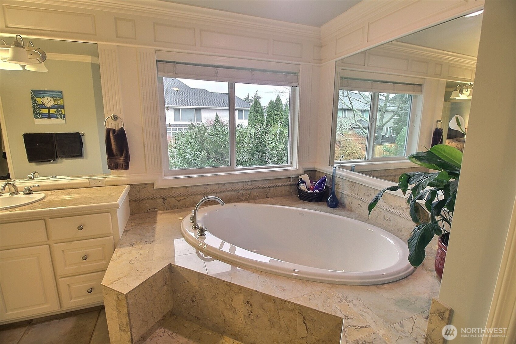 Primary Bath looking out to the Primary Bedroom. Walk In Closet is within bath area.