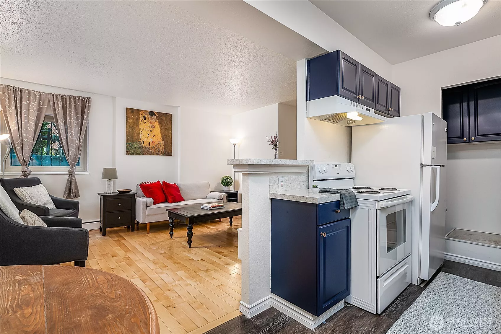 DARLING 2 bedroom condo-home with in-unit laundry hook-ups, hardwood floors (and windows on both sides of the living room) This sweet condo would be a wonderful home OR rental unit! (and it comes furnished!! *with a few decorator exceptions- ask LA for list)