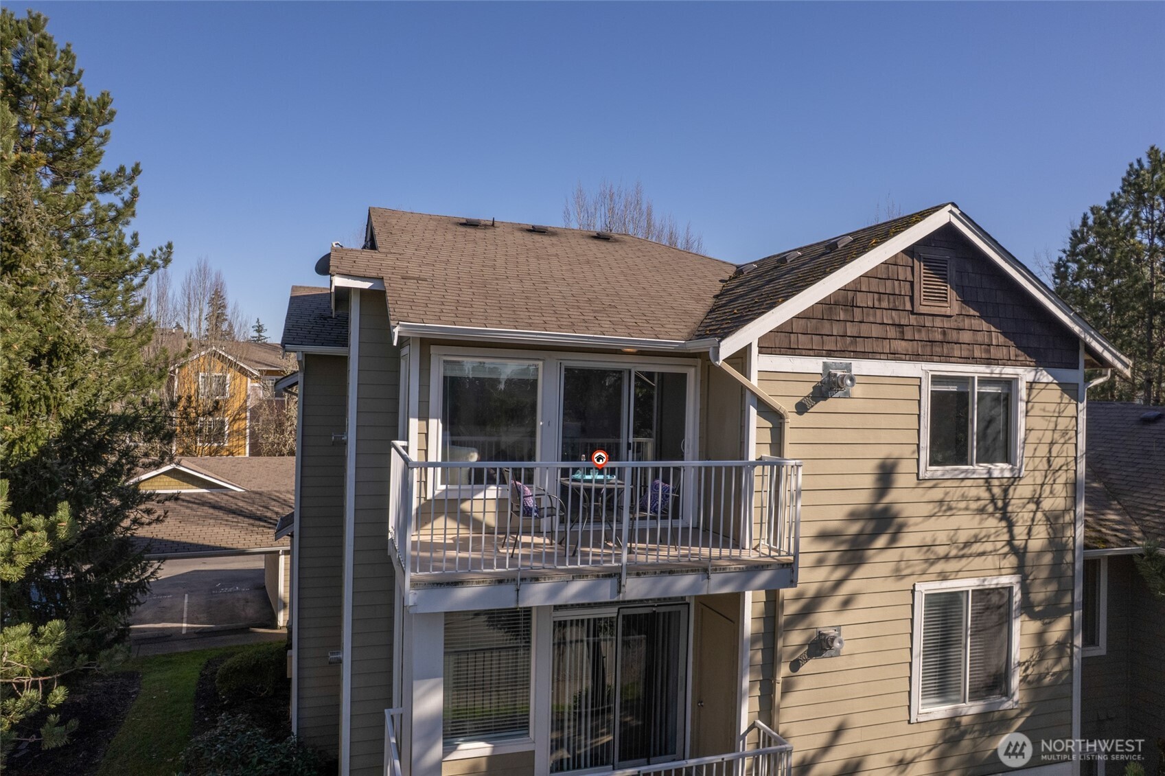 Top floor offers private deck and storage shed