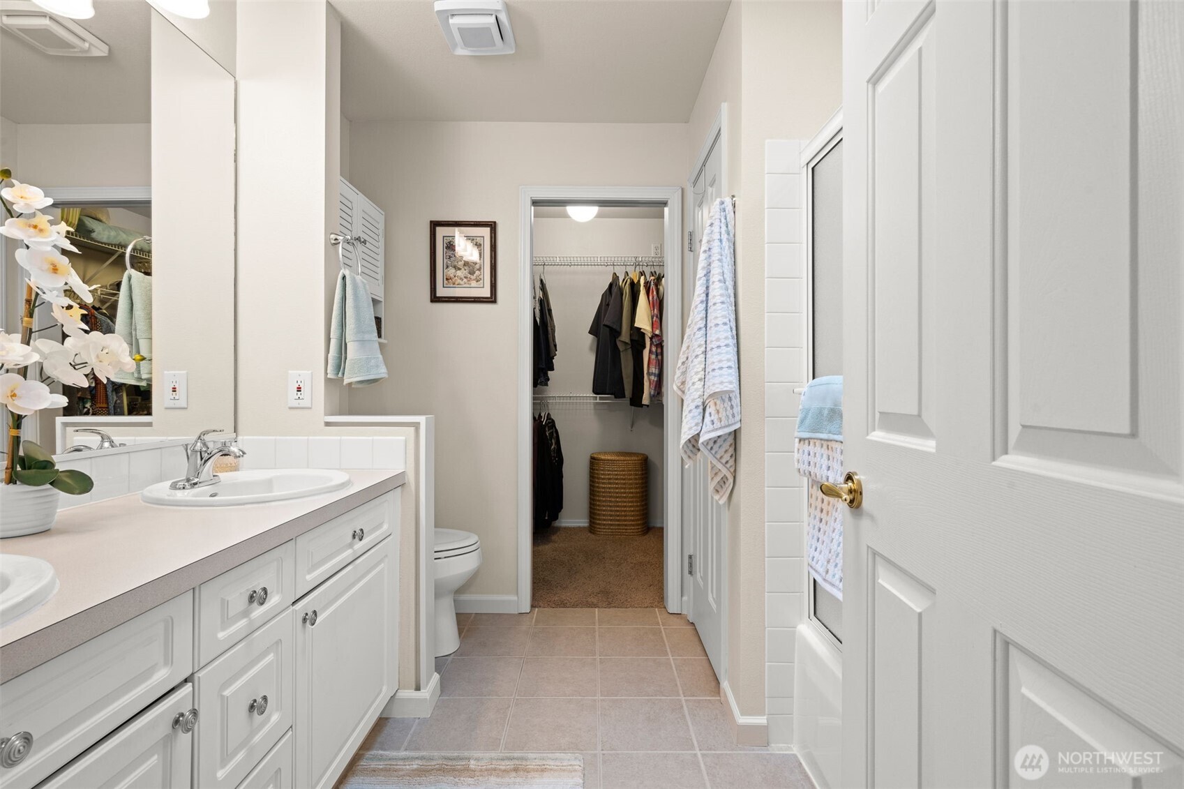 Here is the same view showing the closet door open. The tub/shower combo is behind the bathroom entry door on the right.