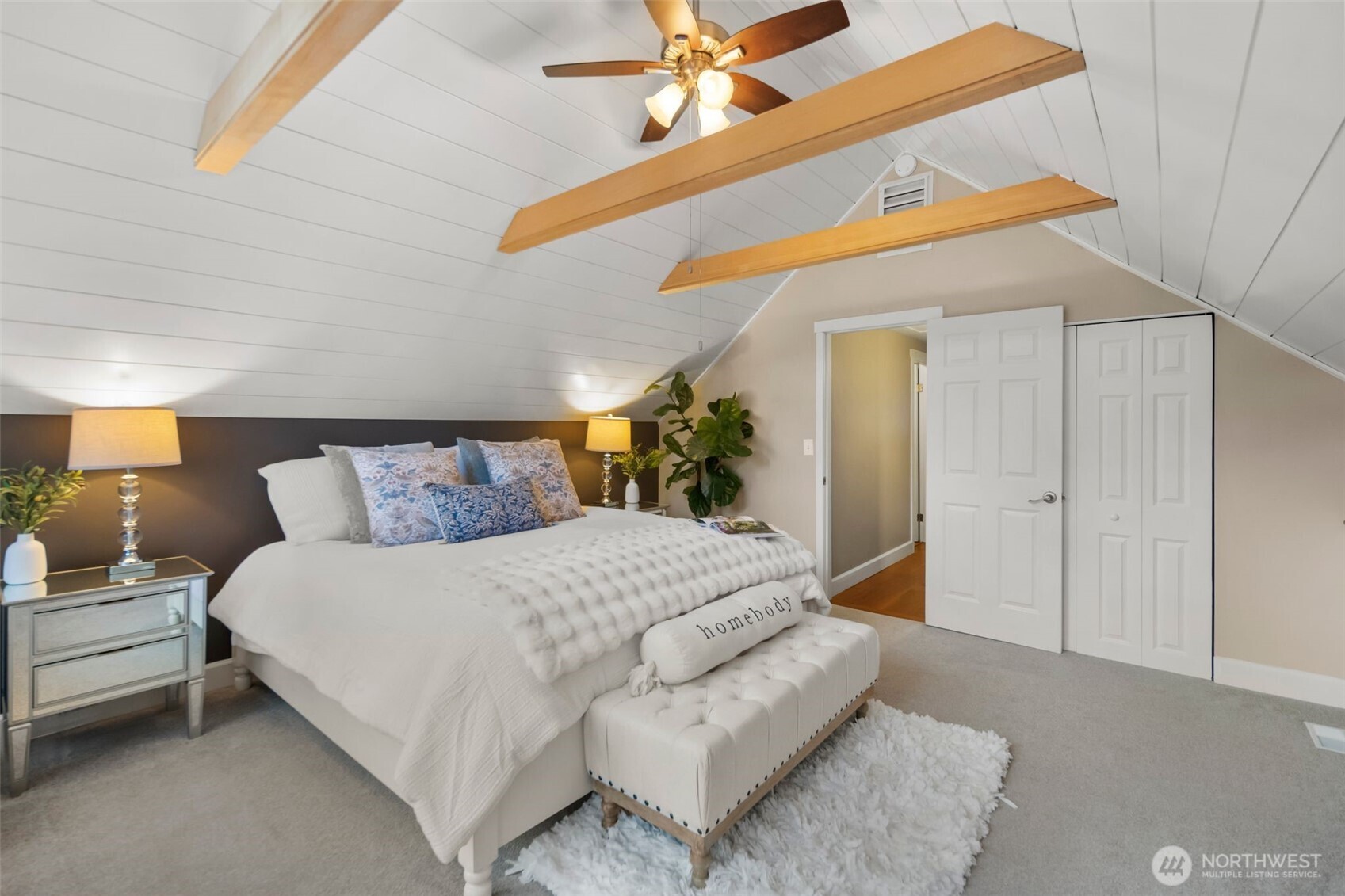 Primary suite with floor to ceiling windows and a old world romantic feel.