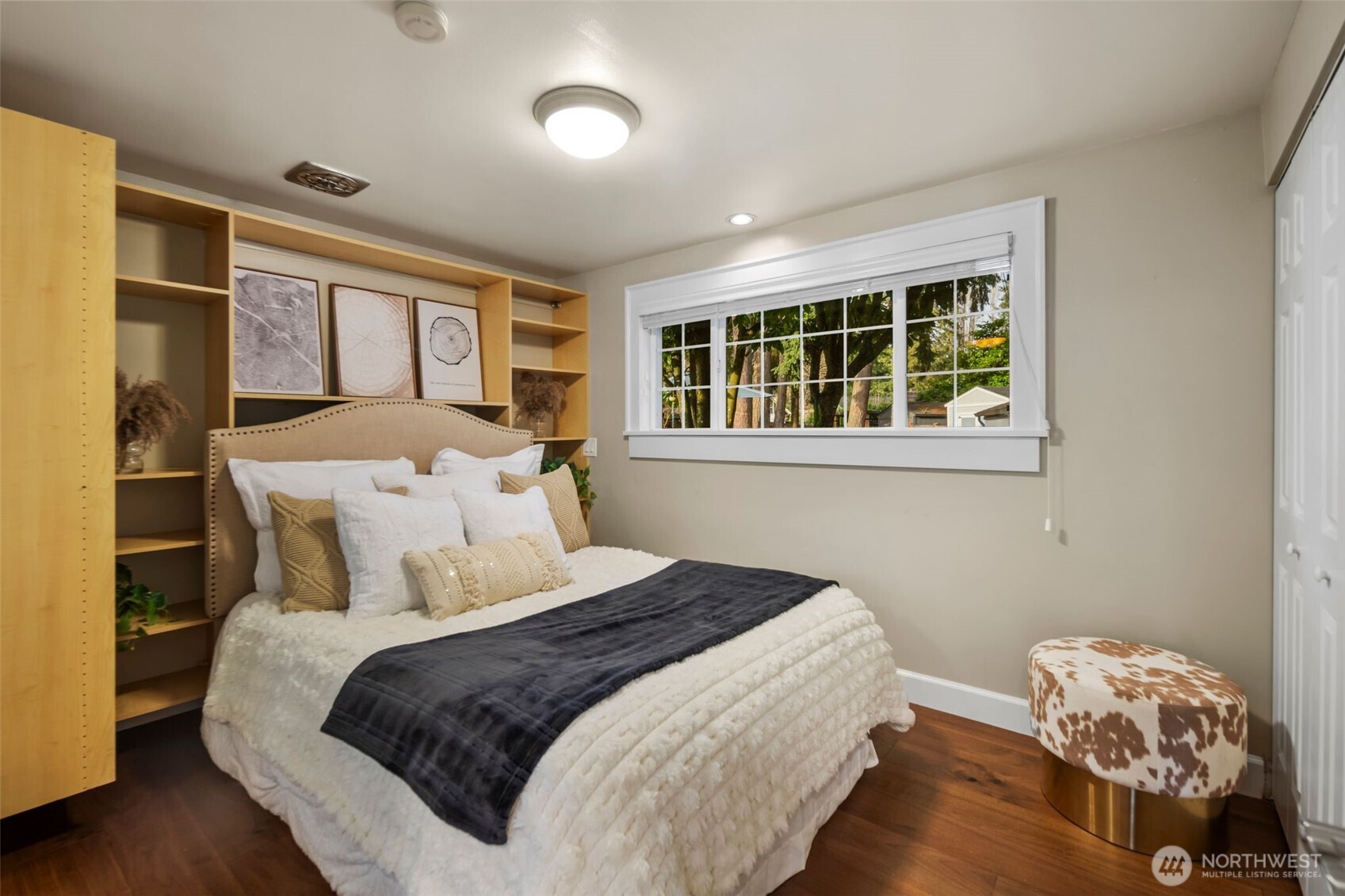 4th Bedroom with build in shelving a view of the backyard and plenty of extra closet space.