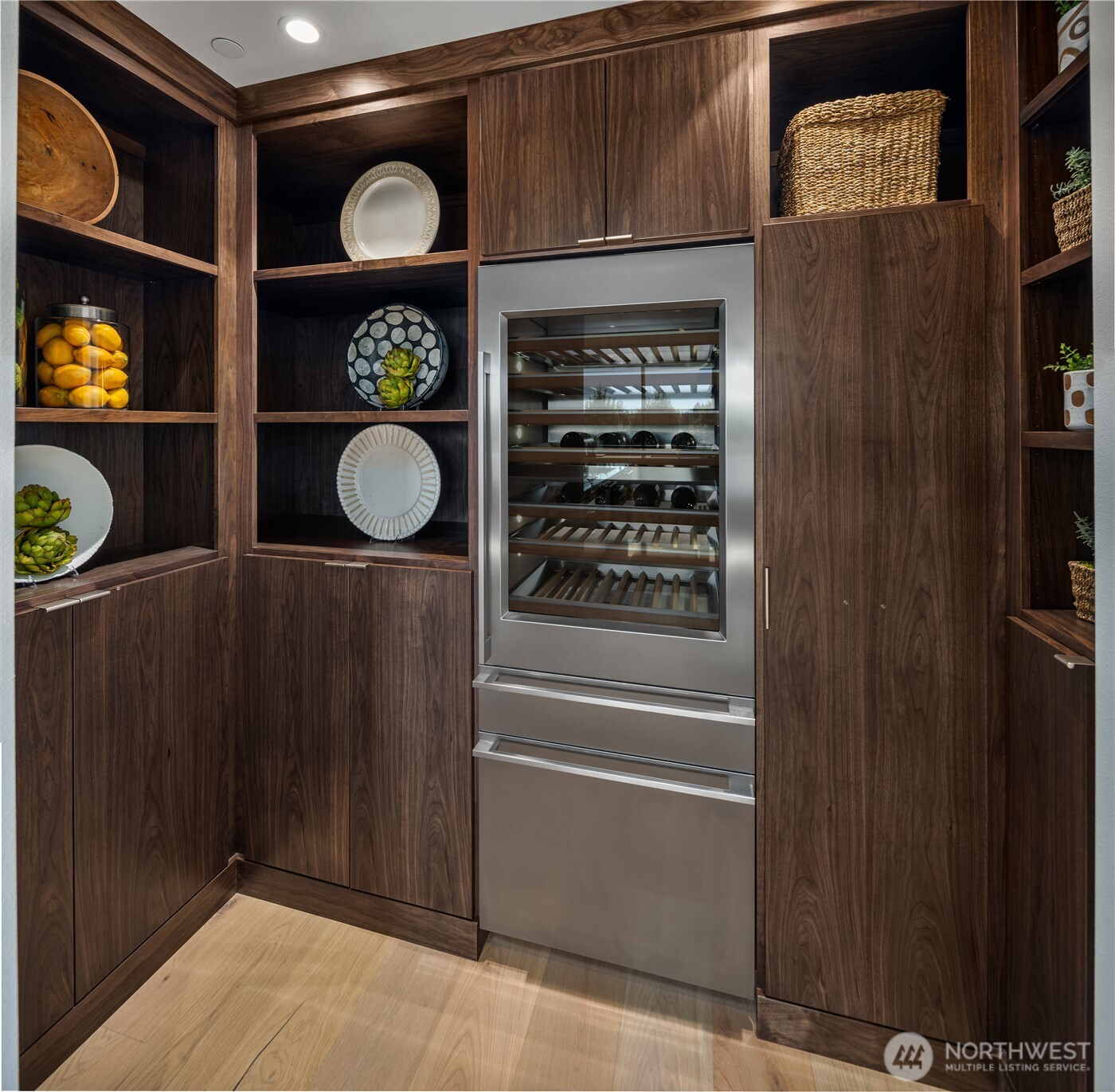 Giant pantry with custom cabinetry and Monogram integrated wine sommelier