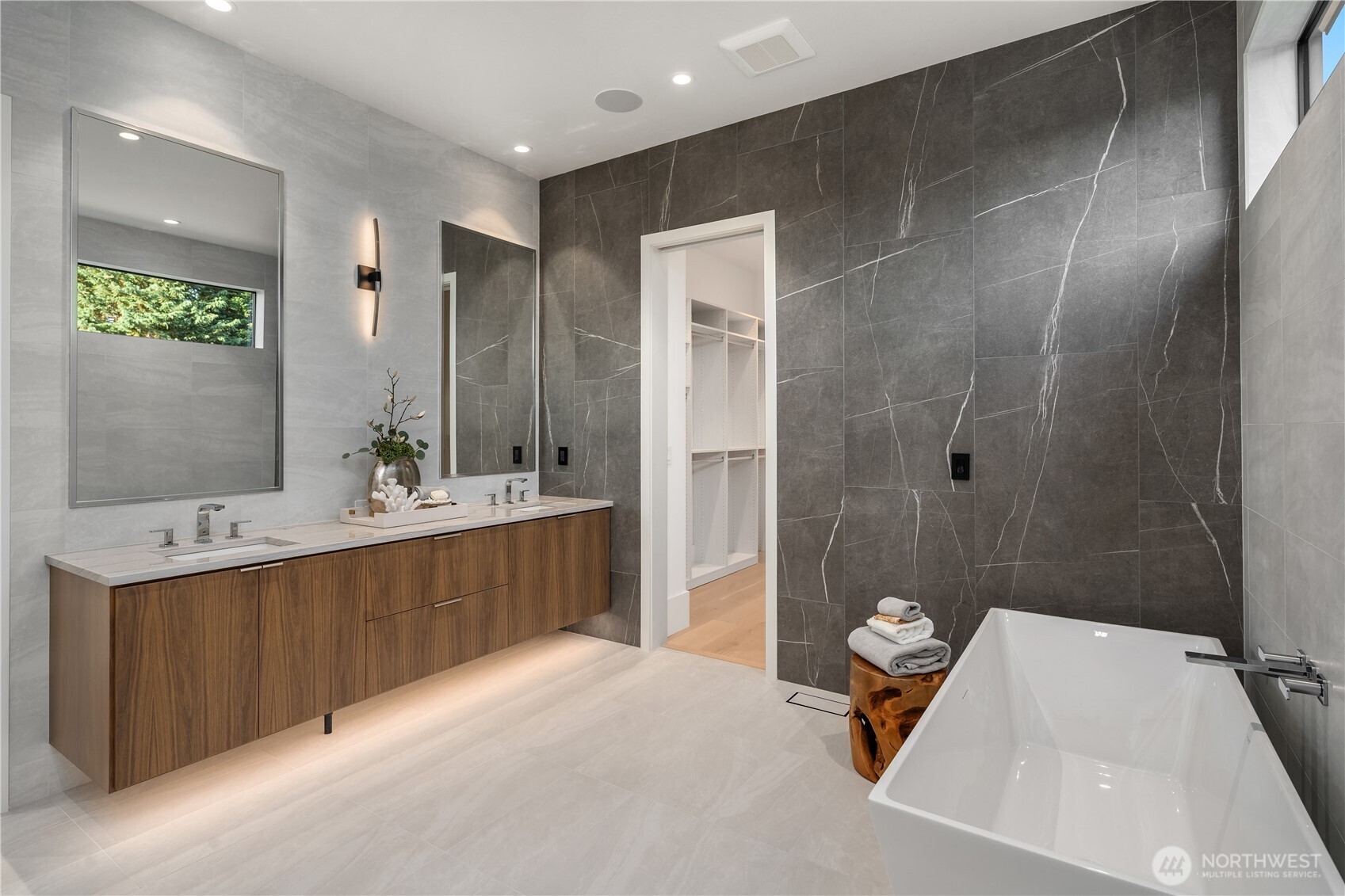 Primary bath with soaking tub and custom walk-in closet