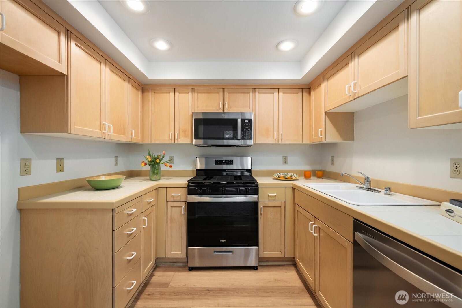 Kitchen with new appliances and storage galore.   New LVP flooring and freshly painted.