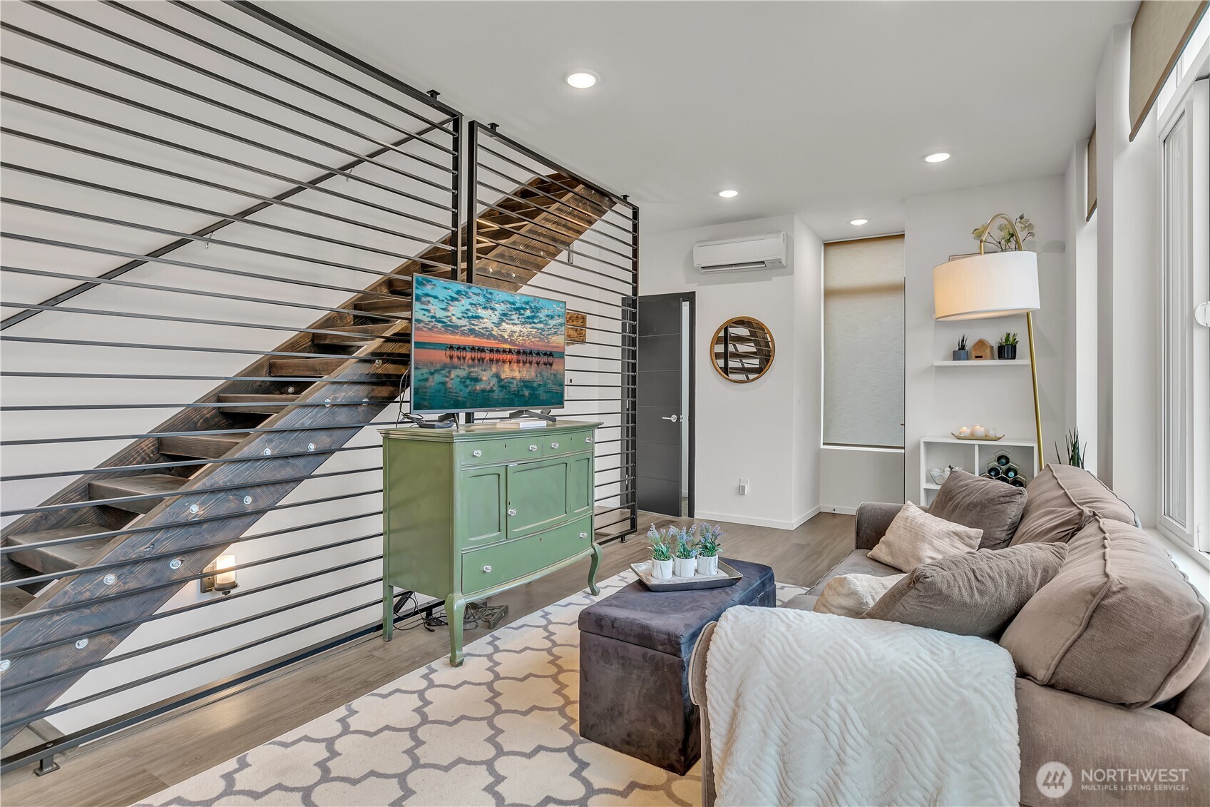 Architectural wooden open slate stairs create an airy feeling.