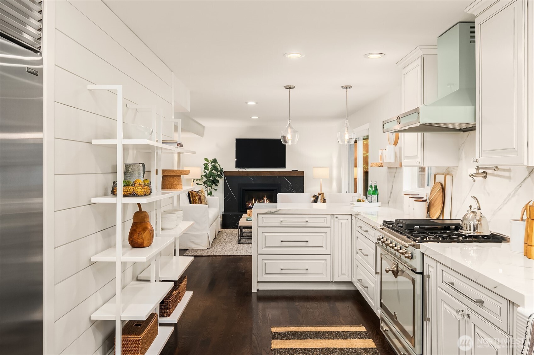 This kitchen is emphasized by an exquisite La Cornue gas cooking range and vent hood. Luxury!