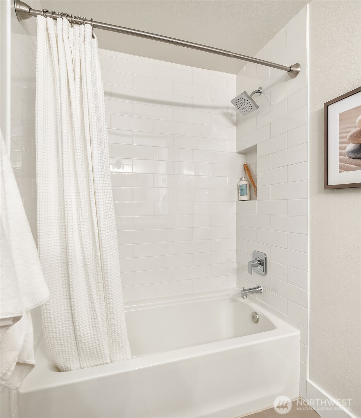 This second bedroom at the end of the upstairs hallway features a substantial picture window with custom black-out shade.