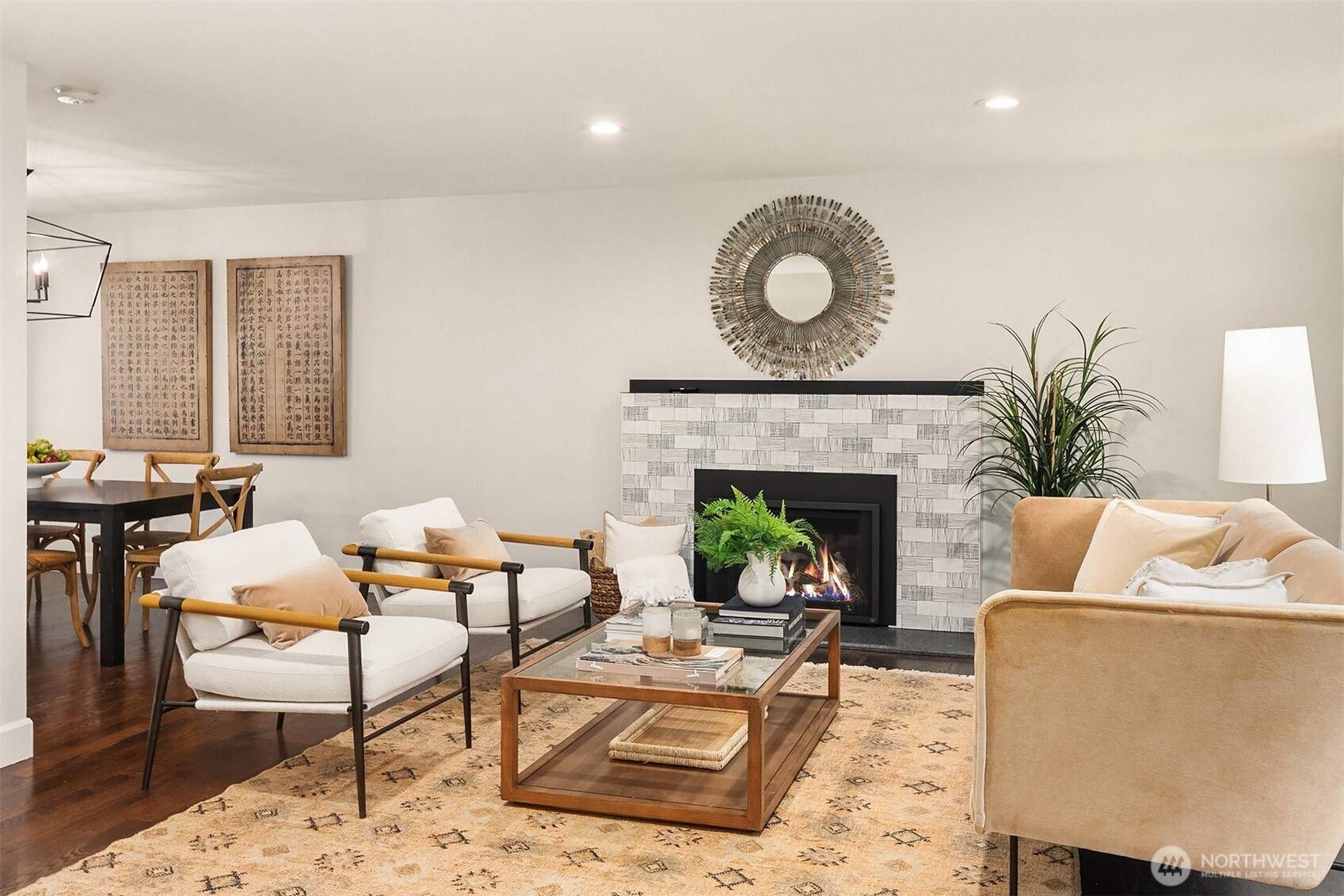 Views of the lovely living room featuring the unique gas fireplace surround.