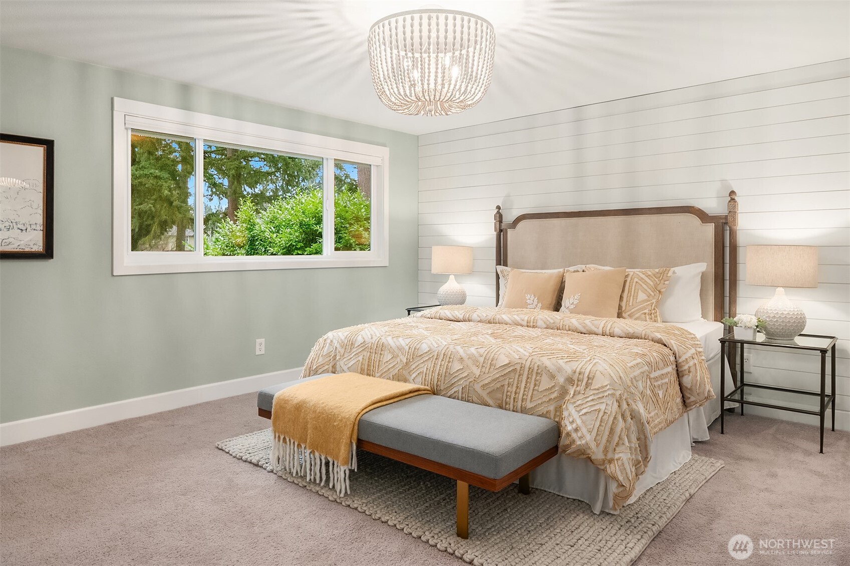 Looking toward the primary ensuite doorway and built-in closet storage with barn door feature.