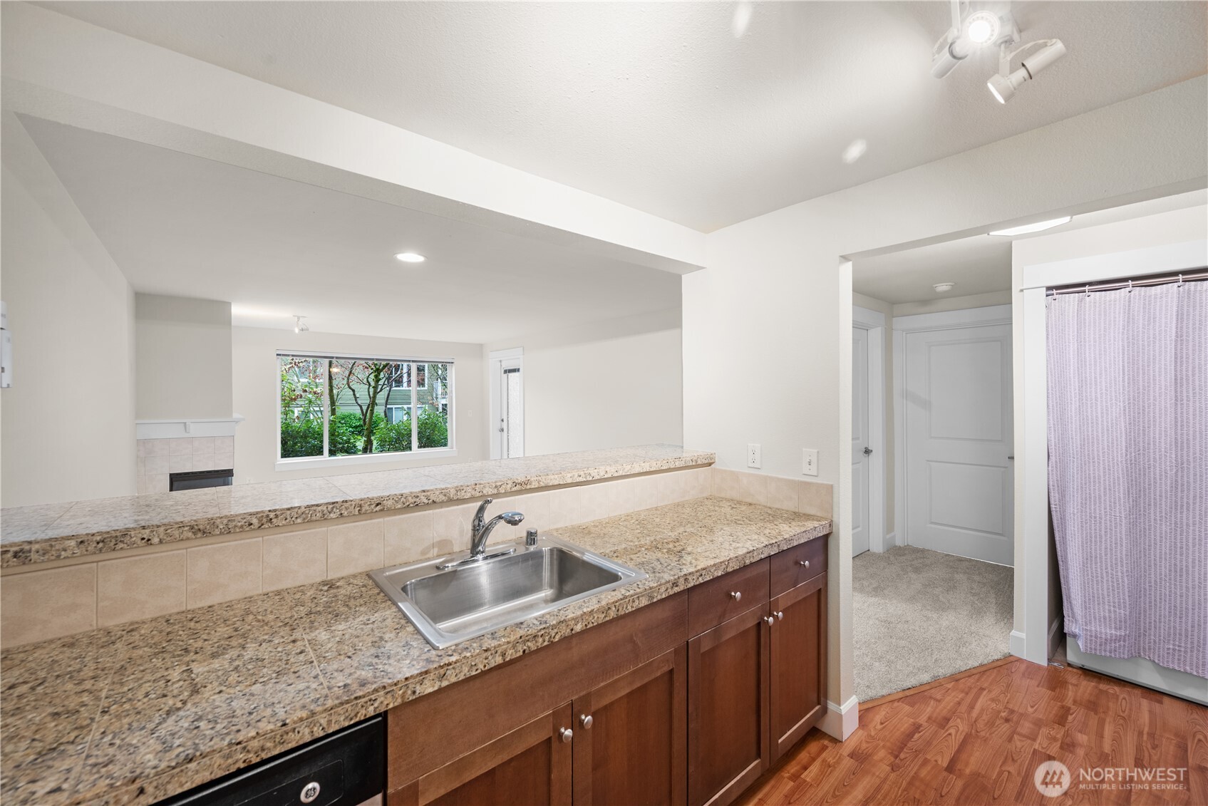 Kitchen opens onto living room.