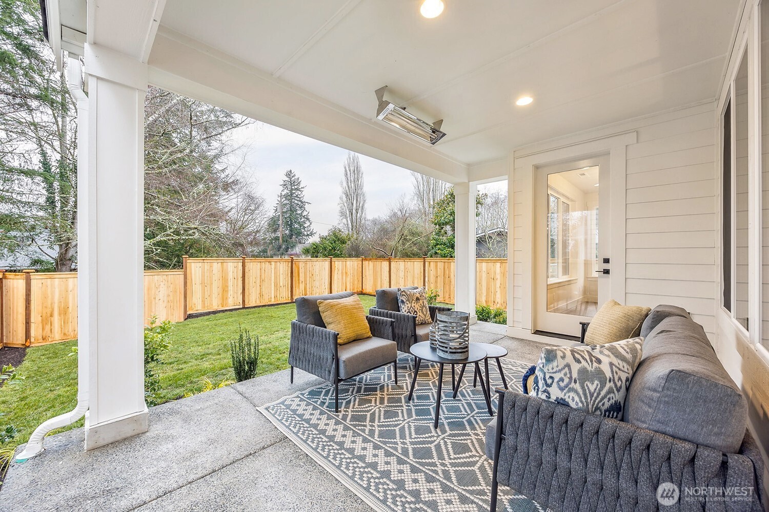 Outdoor covered living area. Photos are of the Magnolia model home at Maywood Heights on lot 8. Photos are for illustration purposes only; colors and finishes will vary.