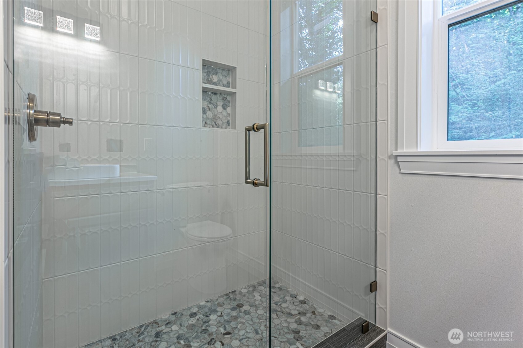 Walk in Pantry with lots of natural light and sleek built-in's