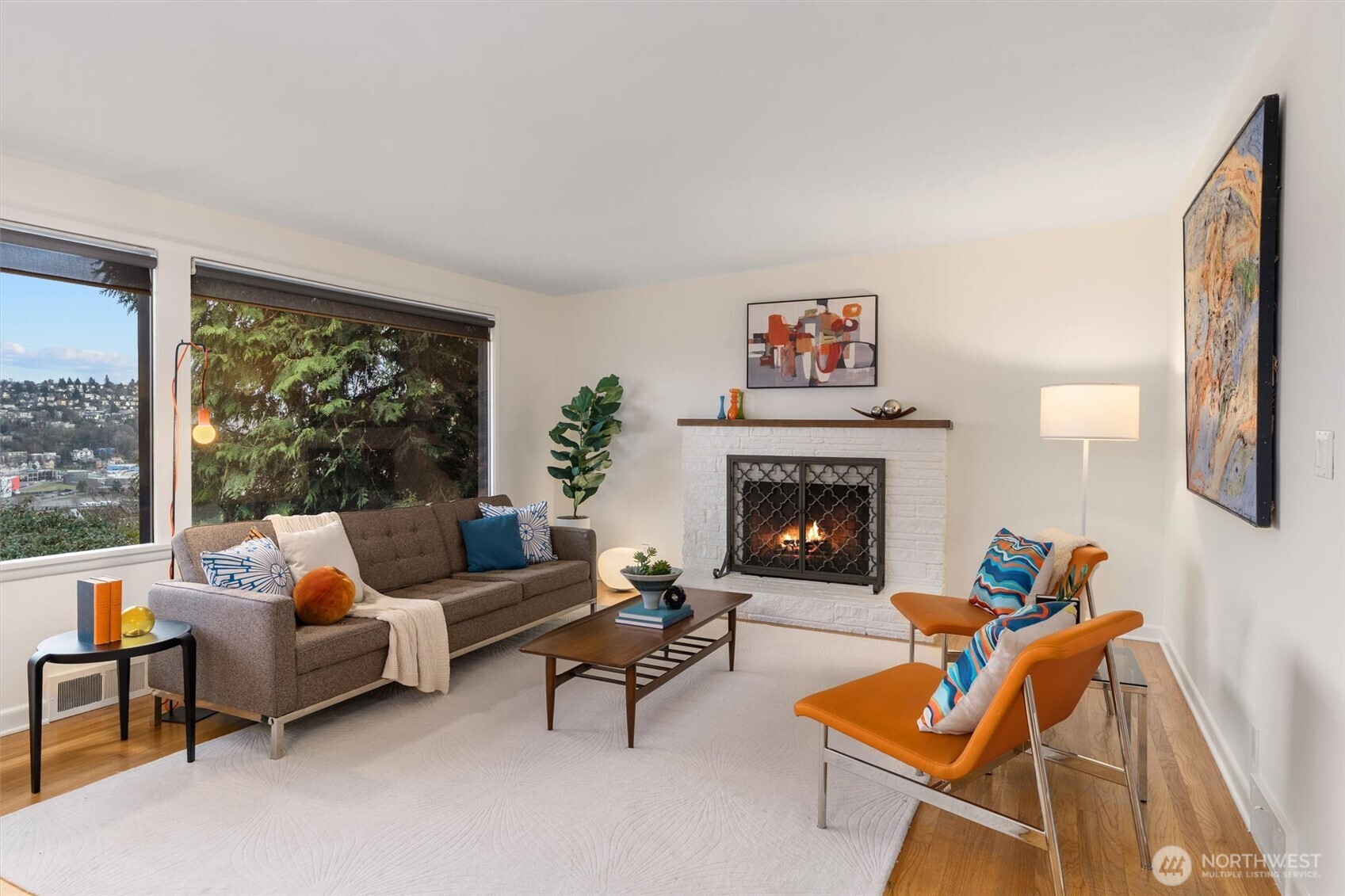 Expansive living room with walls of windows framing the gorgeous views