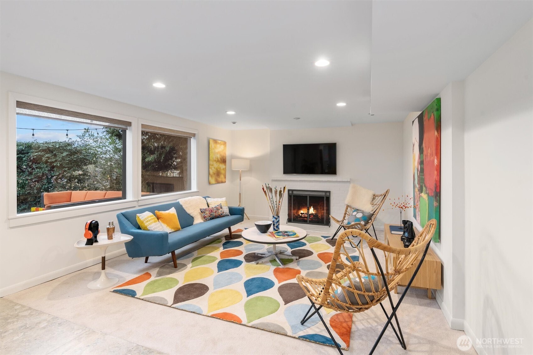 Second living room downstairs with a cozy fireplace