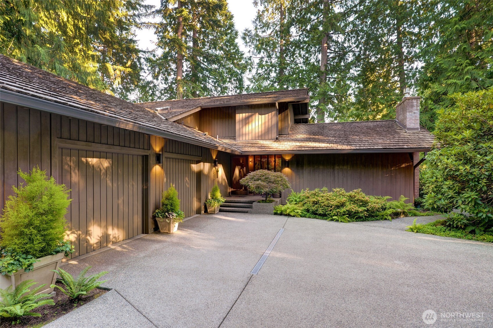 Large 2 car garage to left of entrance offers perimeter built in cabinetry, tons of storage, and stairs leading up to a huge attic.