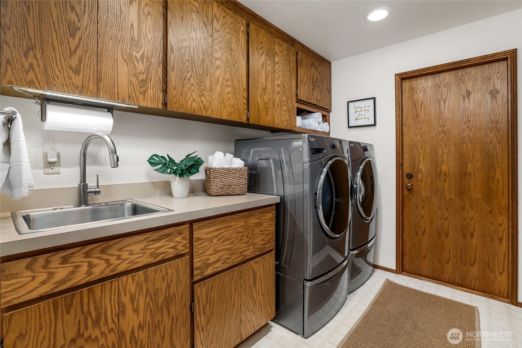 First floor Laundry room leads to oversized 2 car garage.