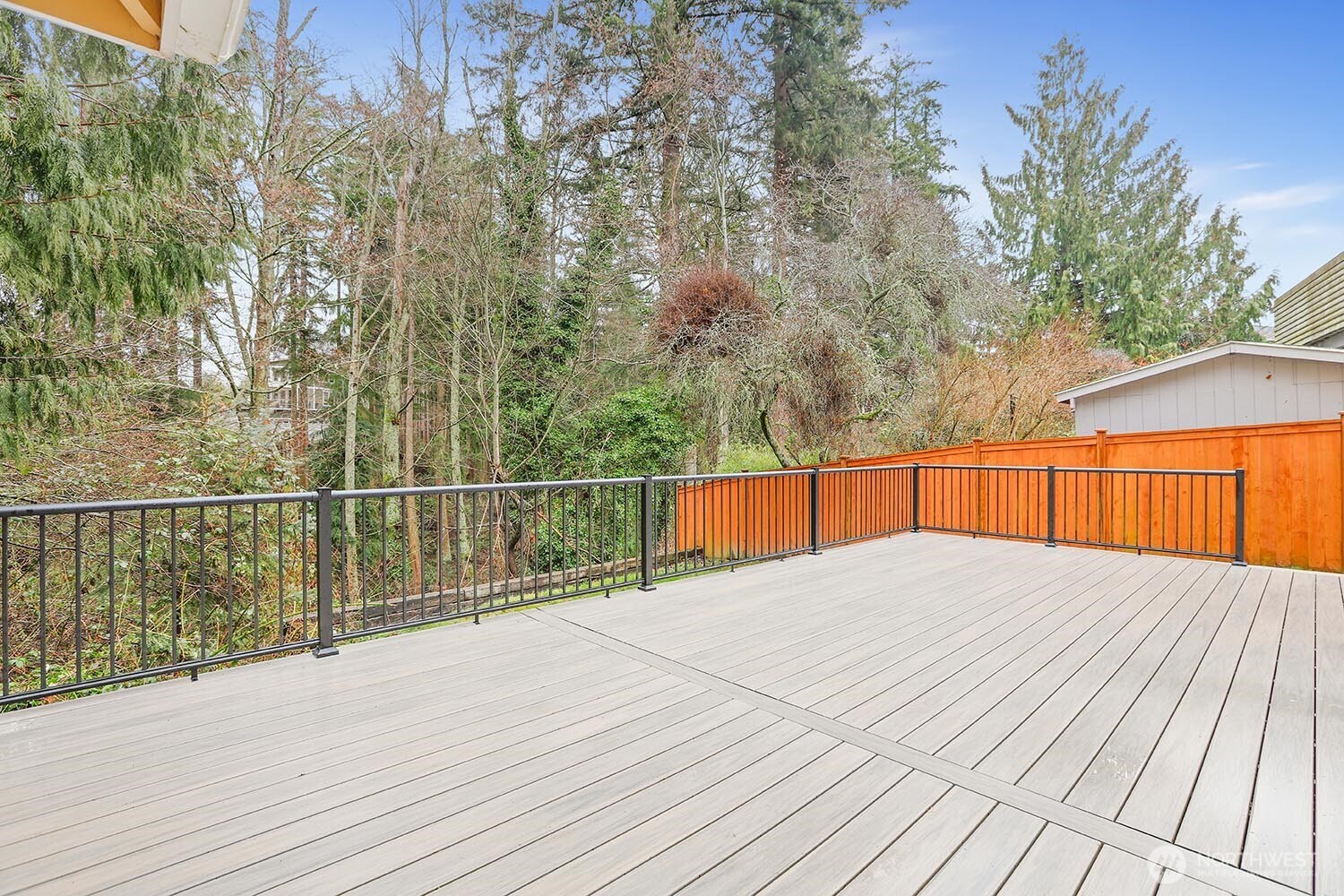 New composite deck and new cedar fence in back yard.