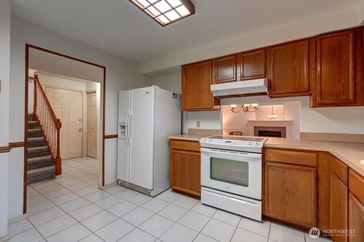 Opposite view. All appliances will convey with the home including the refrigerator.