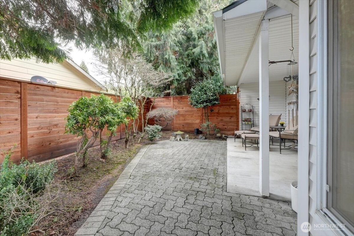 Stone patio enlarges the entertaining area of the covered patio.