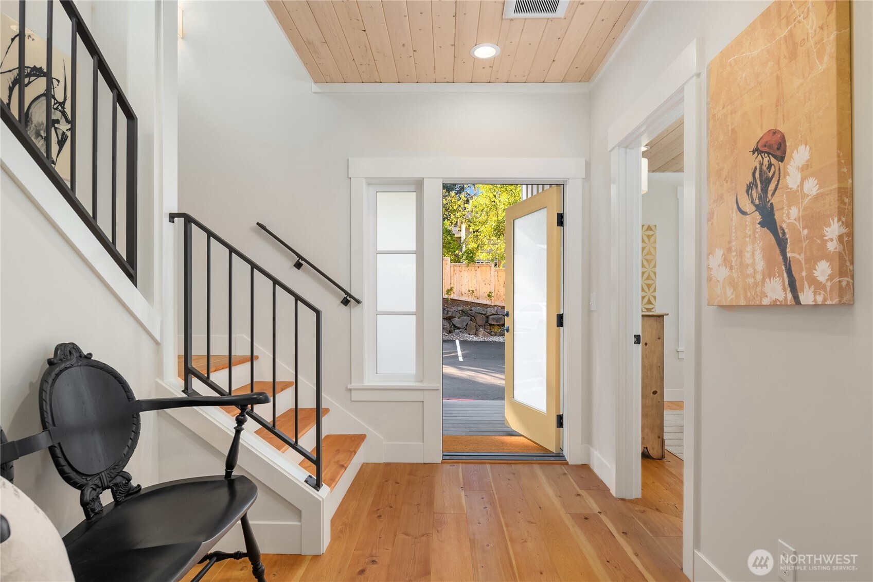 Welcome home to 2214 NE 125th!  The entry opens to a light filled, sunny west facing covered front porch.