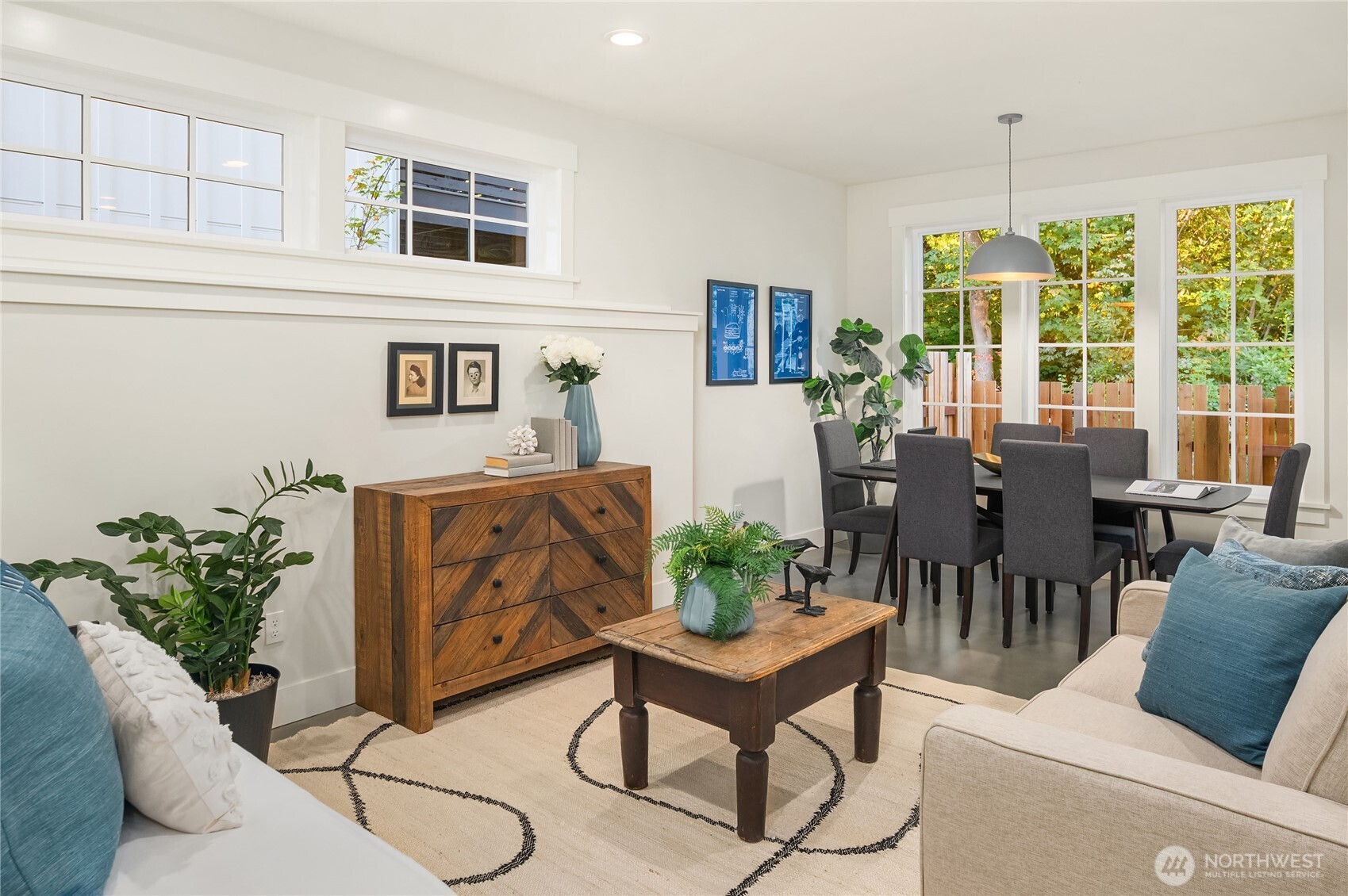 The daylight lower level includes a large studio with private entry and patio and dining room space overlooking the lush gardens and private yard.