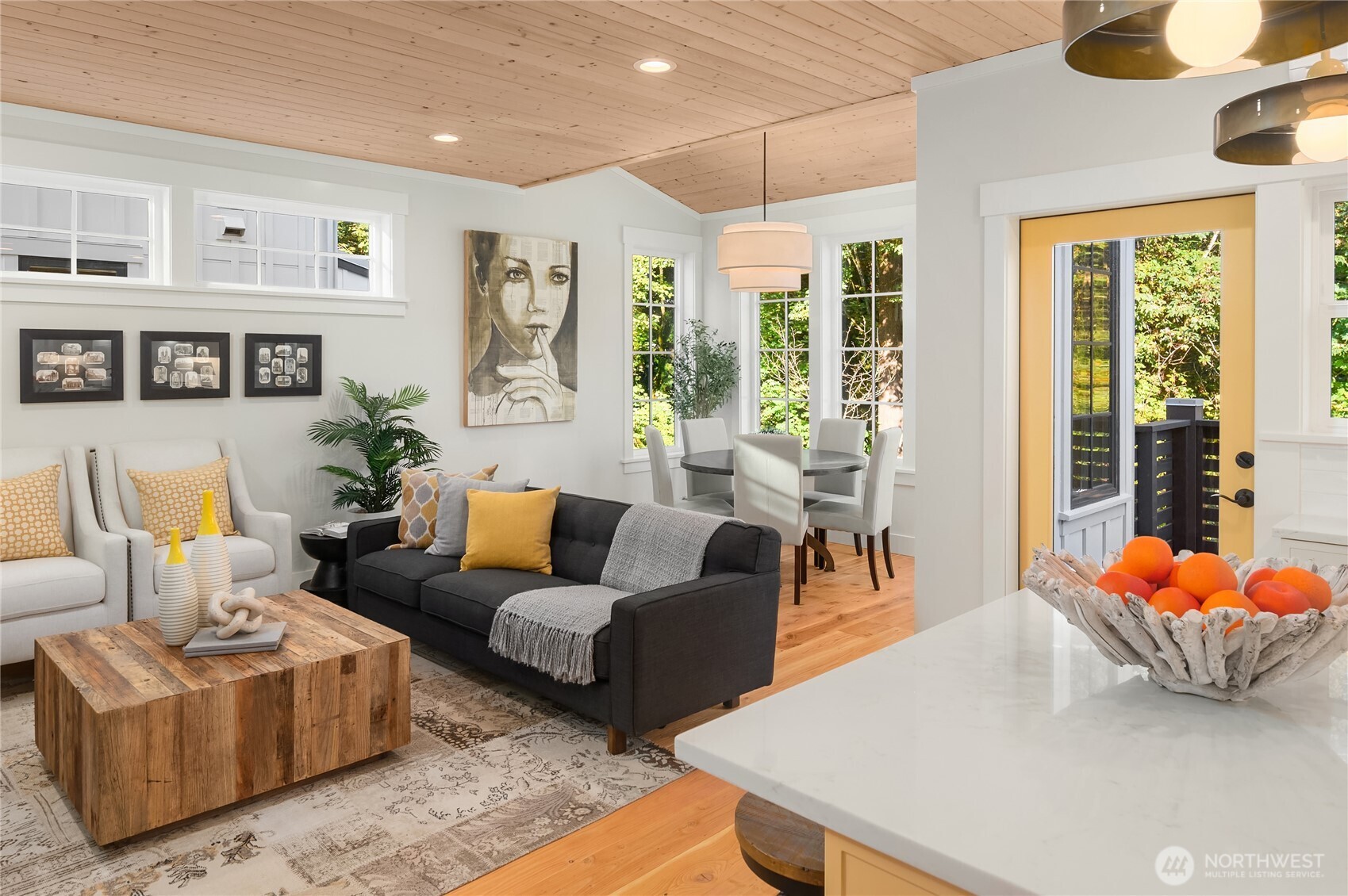 A cozy living room adjacent to the kitchen plus a large dining space that overlooks the preserved open space beyond.