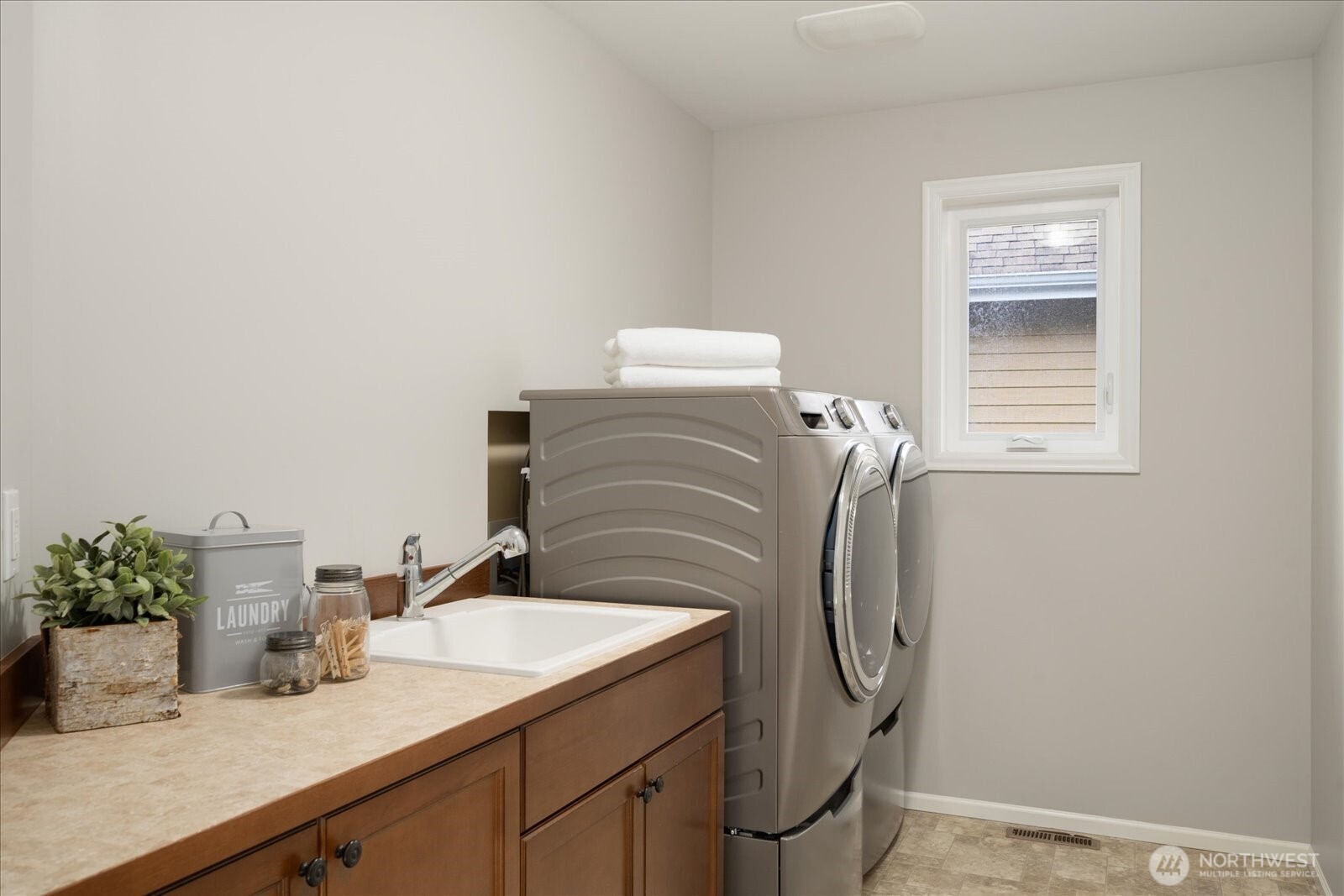 2nd floor laundry room with utility sink/storage/ample countertop space