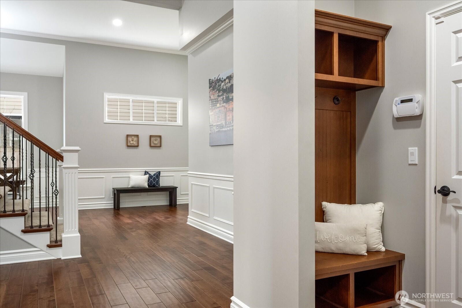 Storage/sitting space as you enter/exit the garage - perfect for coats, shoes, and bags!