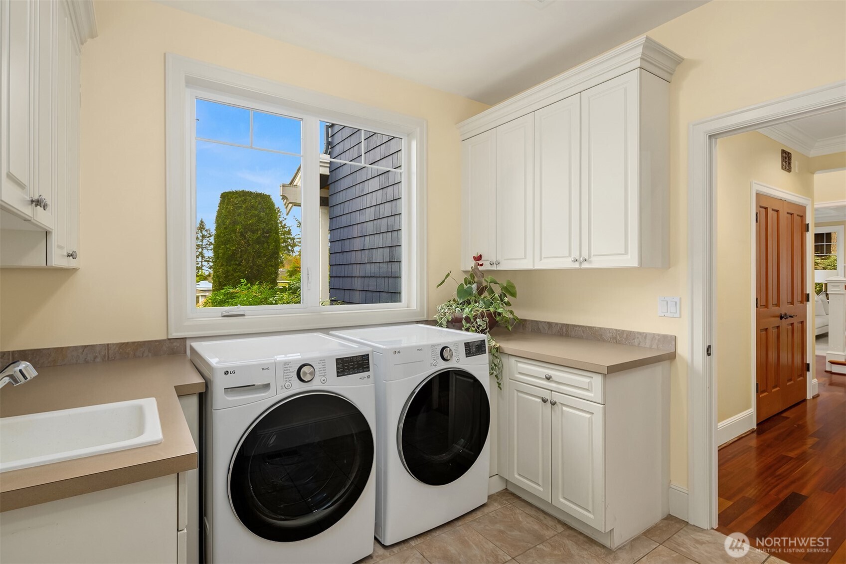 Main floor utility room off the oversized three car garage.