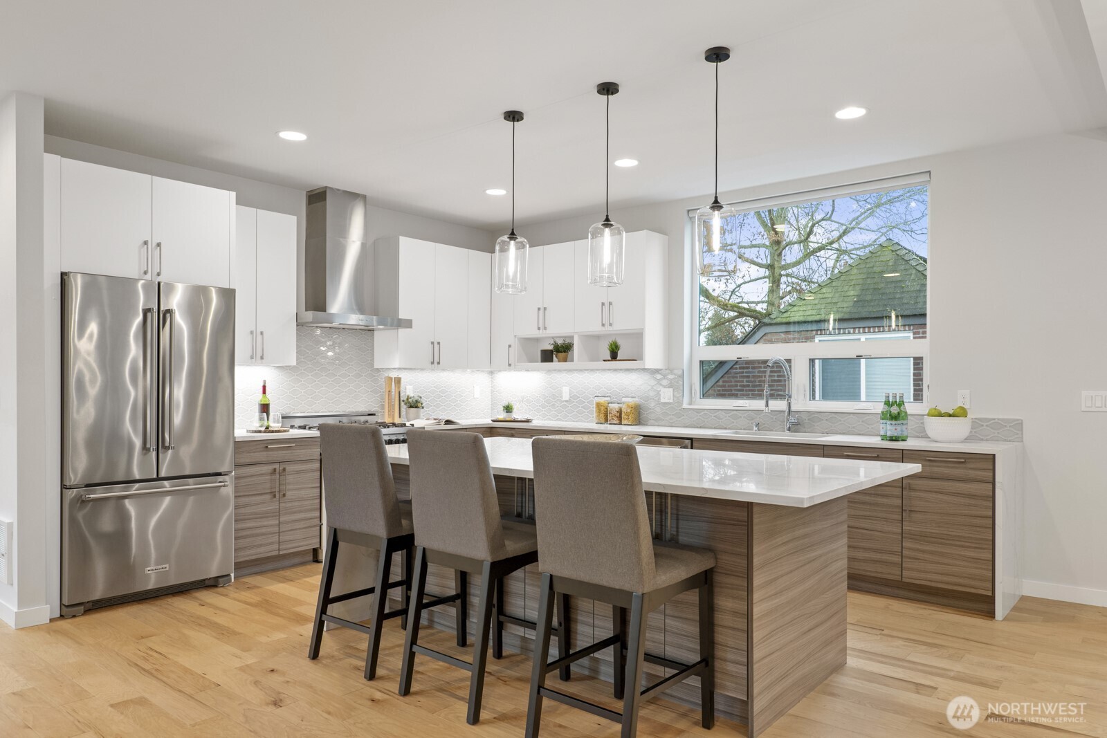 Chef's kitchen with lots of cupboard and counter space. Entertainment size island with beautiful quartz counters. And don't miss the enormous walk-in pantry (not pictured).