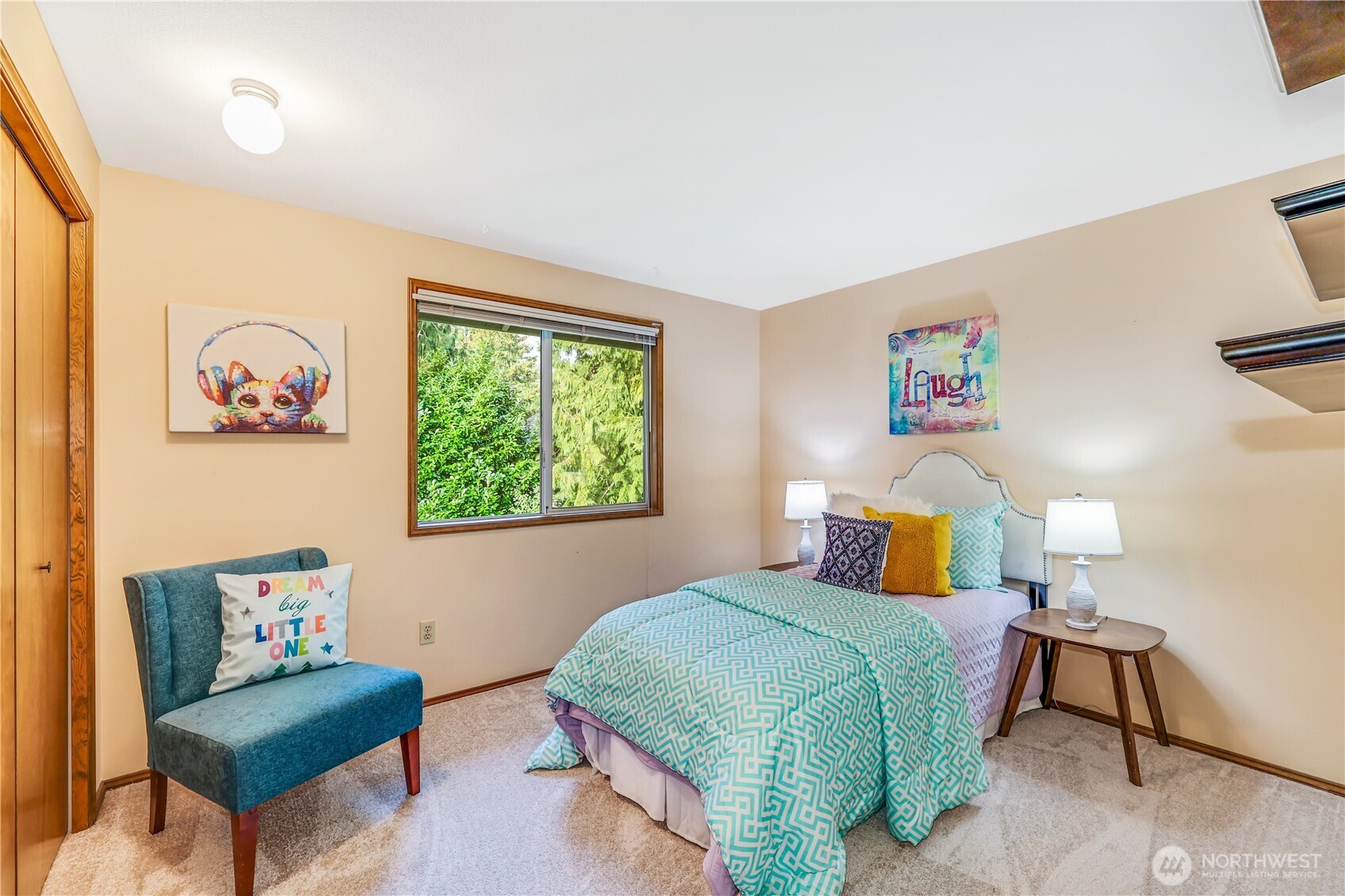 The guest bedroom provides comfort and versatility, with space for a home office or additional sleeping arrangements. The large window ensures a bright and airy feel.