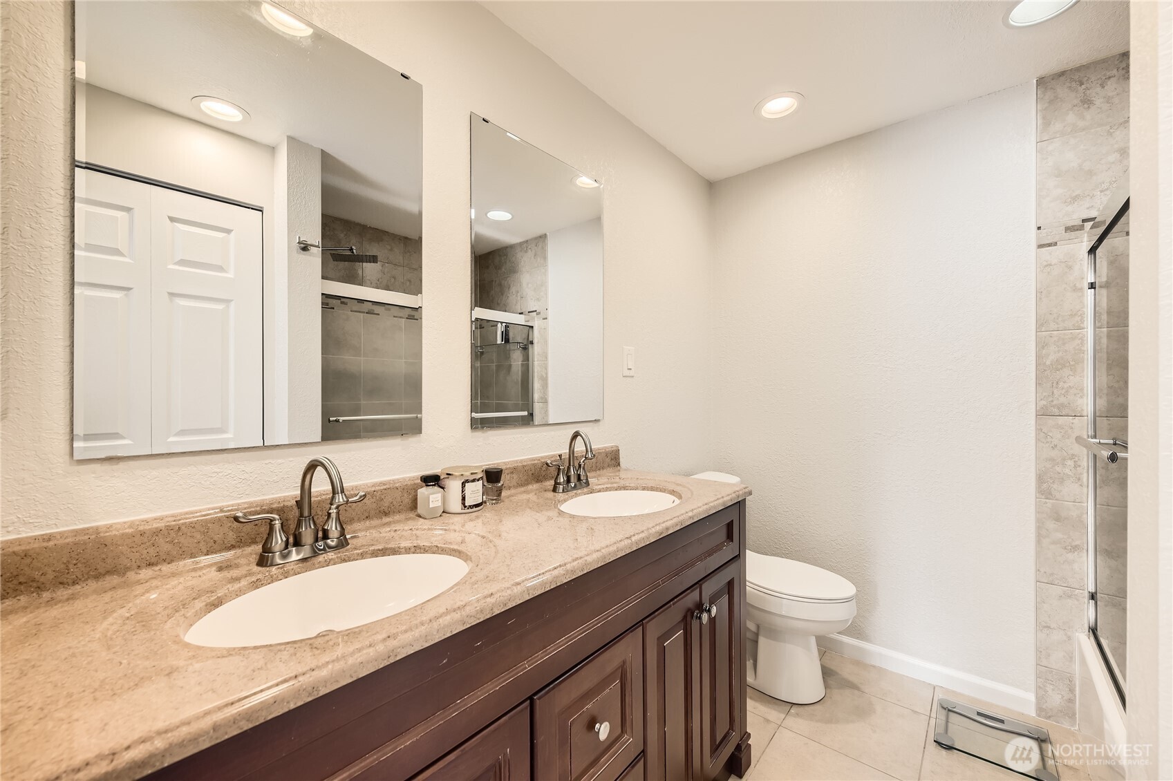 Private bath off of the primary.  Double sinks and gorgeous tile work