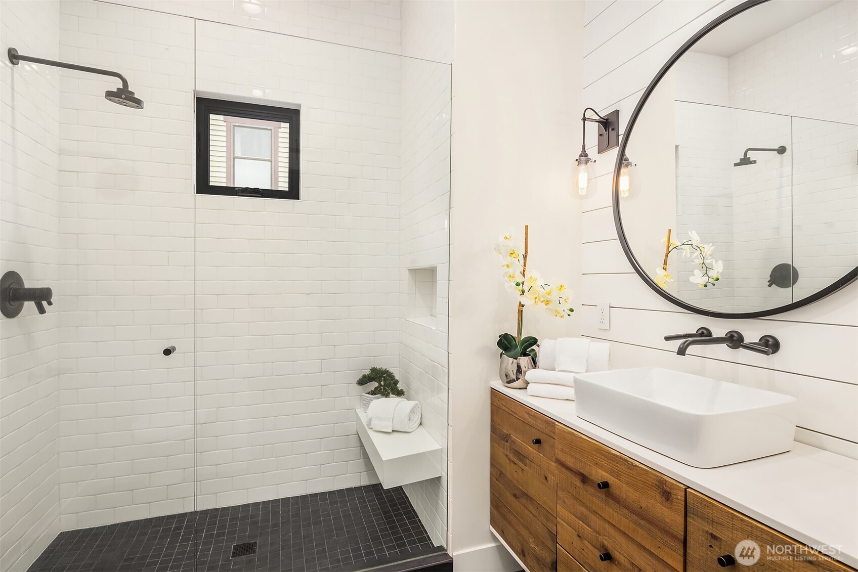 Huge shower, toasty heated floors and a rustic wood vanity make this stylish bathroom worthy of an architectural digest spread.