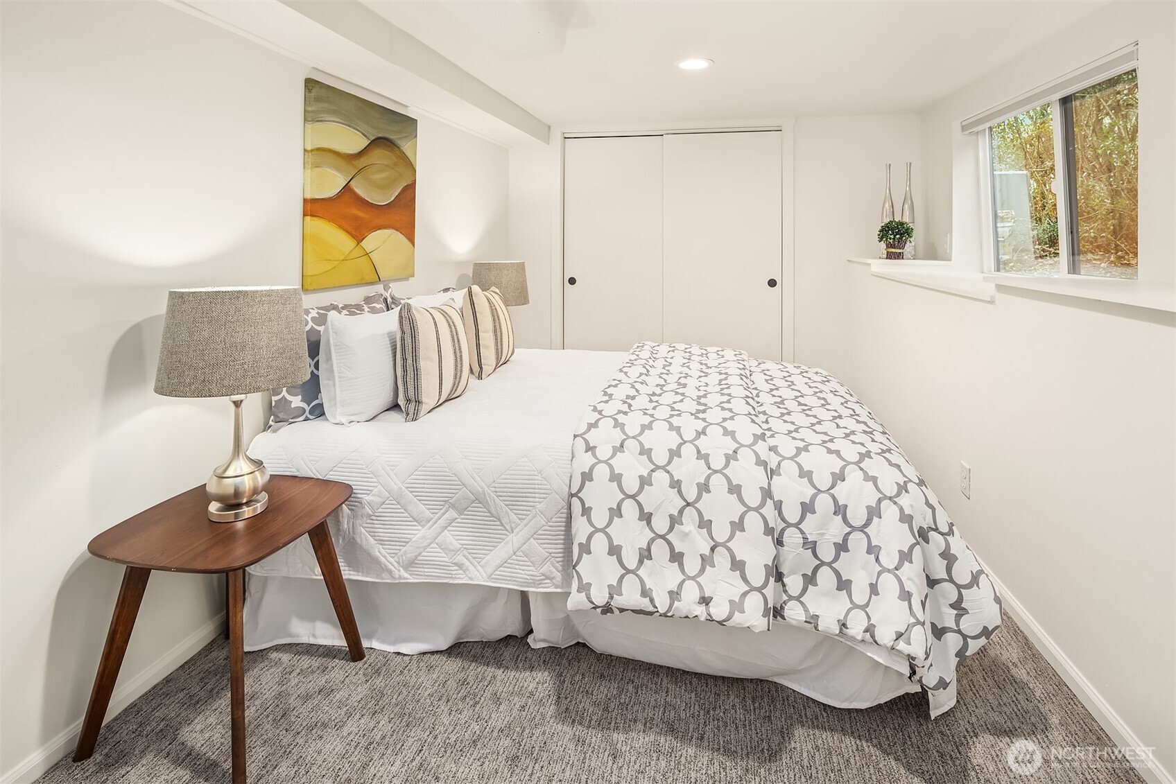 Bedroom 2 on the lower level also has a big window allowing for fresh air flow and an abundance of everyday sunshine.