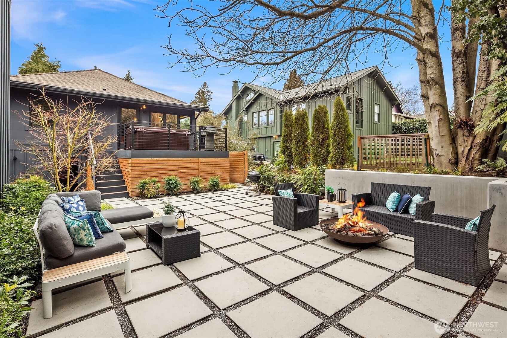 Spectacular back yard! A paver paradise surrounded by mature low maintenance professionally landscaped grounds. Plenty of space to dine, sun bath or relax around the fire.