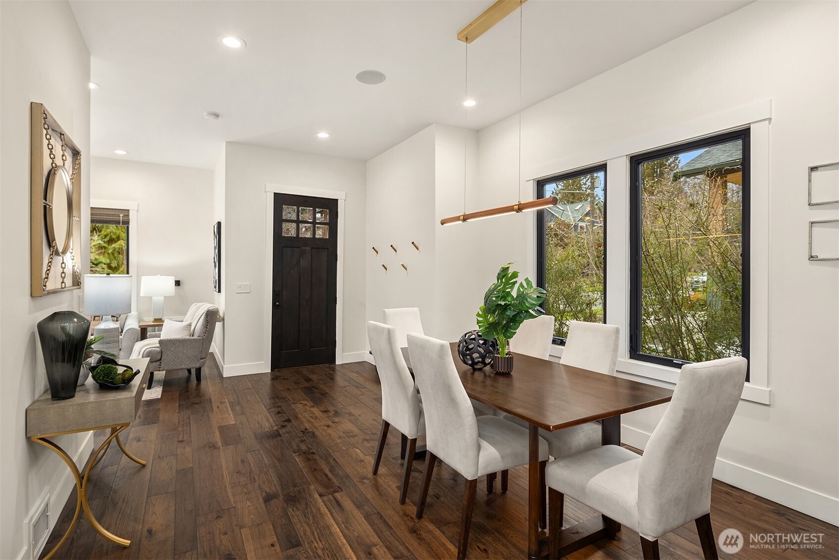 Warm rich engineered hardwood flooring and new black metal Anderson windows all come together to create a space of harmony and style.