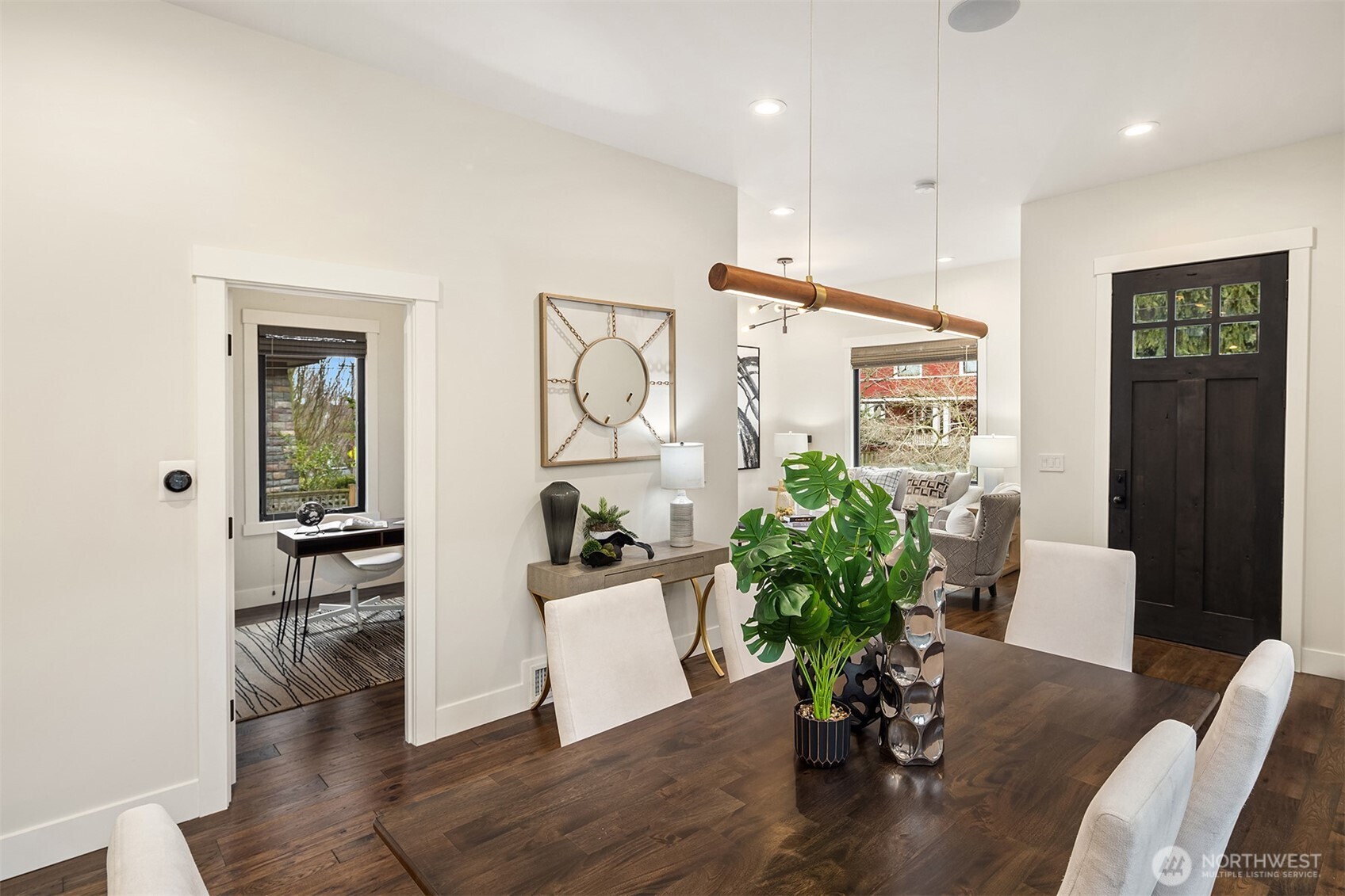 Note the substantial Craftsman style front door with relite windows that allows glorious natural light to filter into the living space.