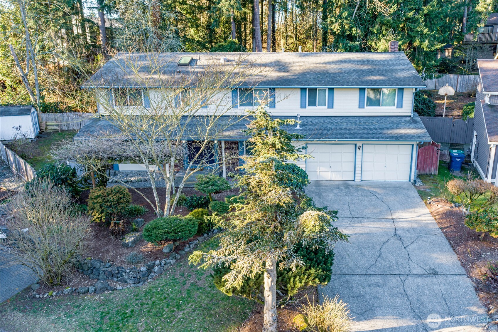 Street view of home and mature garden.