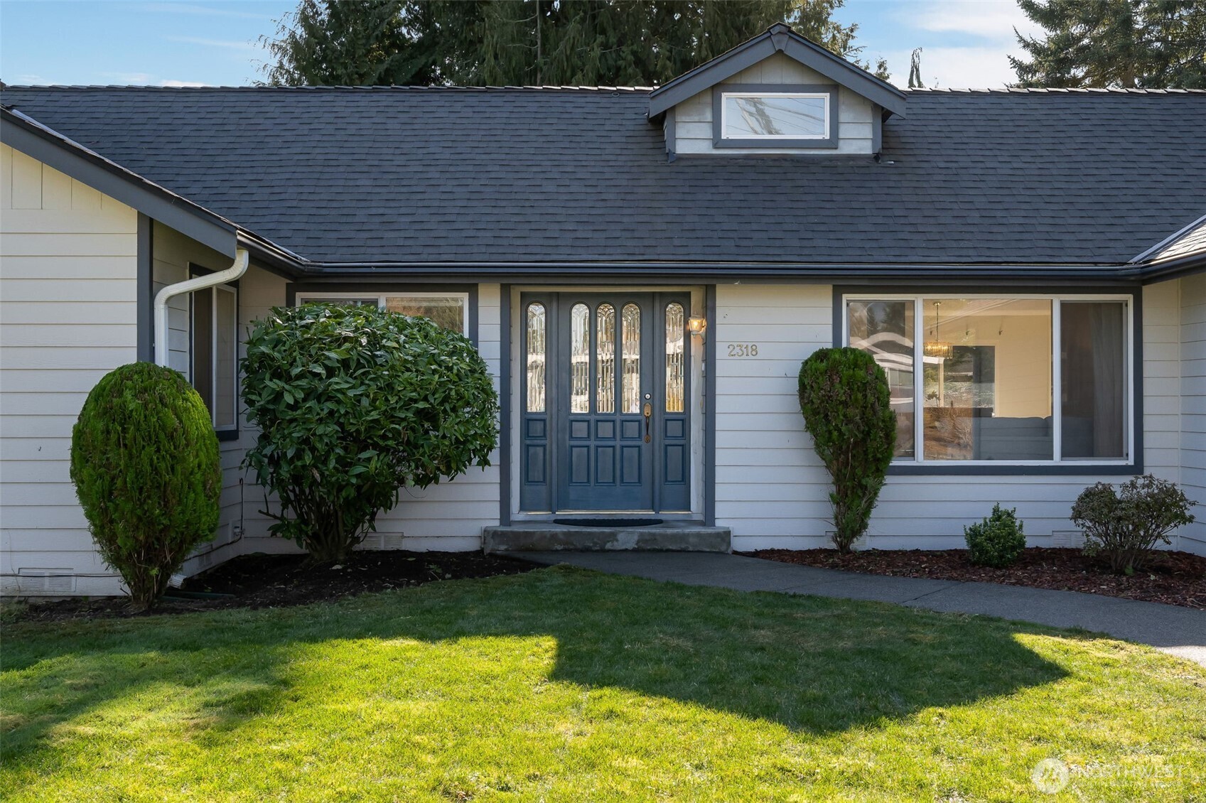 Welcoming front yard brings you to the front door.