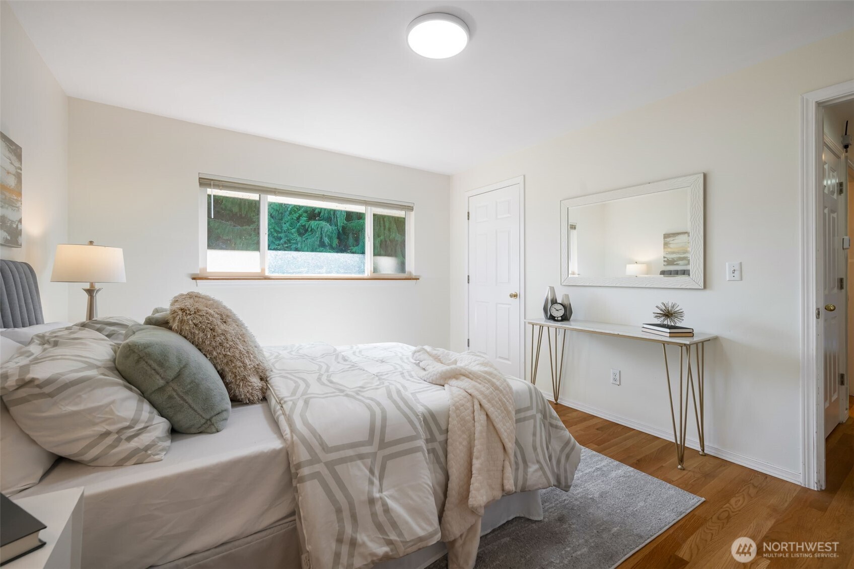 The second bedroom has two closets, and overlooks the backyard.