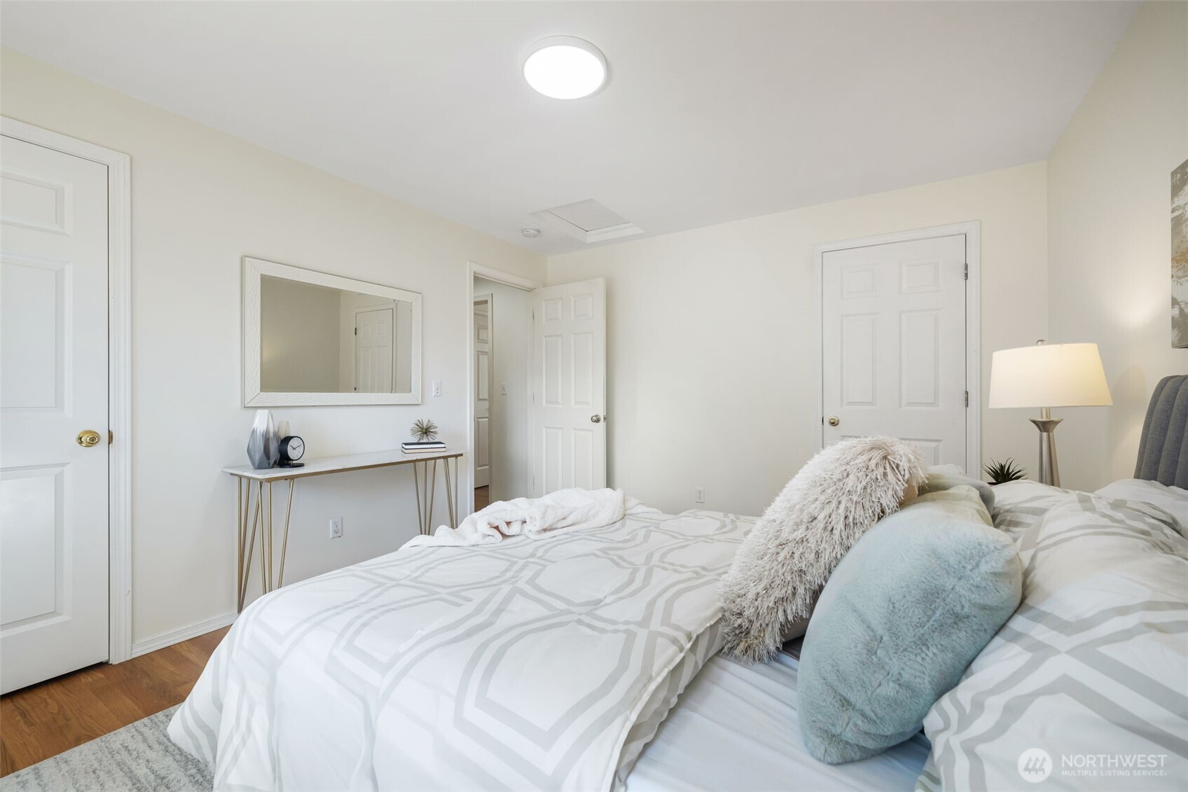 The second bedroom has two closets, and overlooks the backyard.